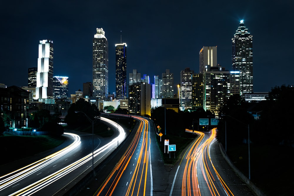 City highways streaked with light trails at night — a connected, always-on network