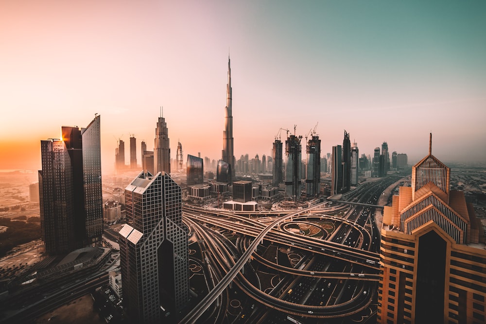 A modern city skyline at golden hour — real-estate assets ready to tokenize